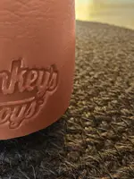 The Hankey's Toys logo pressed into the silicone at the base