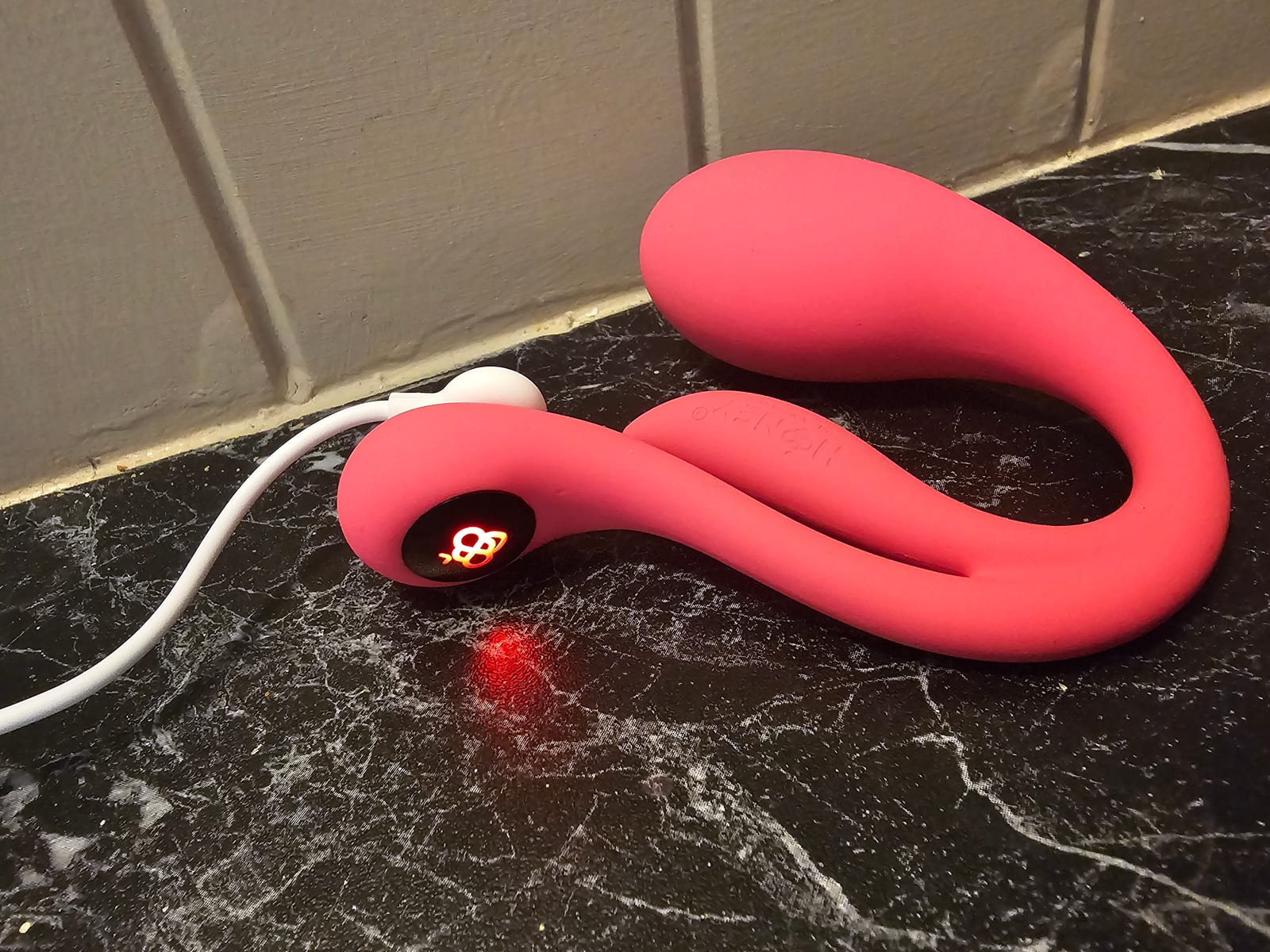 Vibrosa Mini charging with the LED tail logo lit